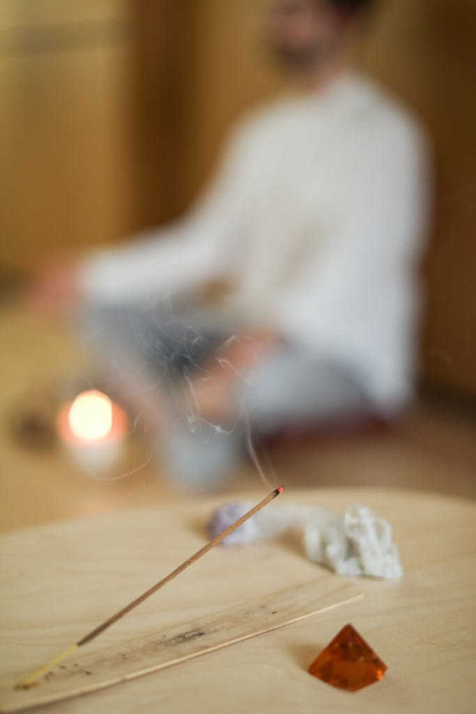 A serene indoor scene of meditation with incense and crystals, enhancing mindfulness and relaxation.